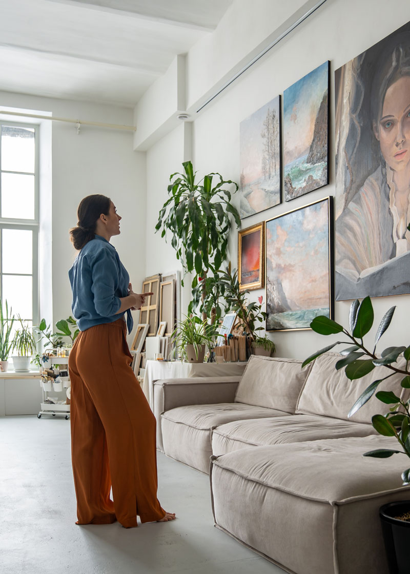 Home owner viewing gallery wall