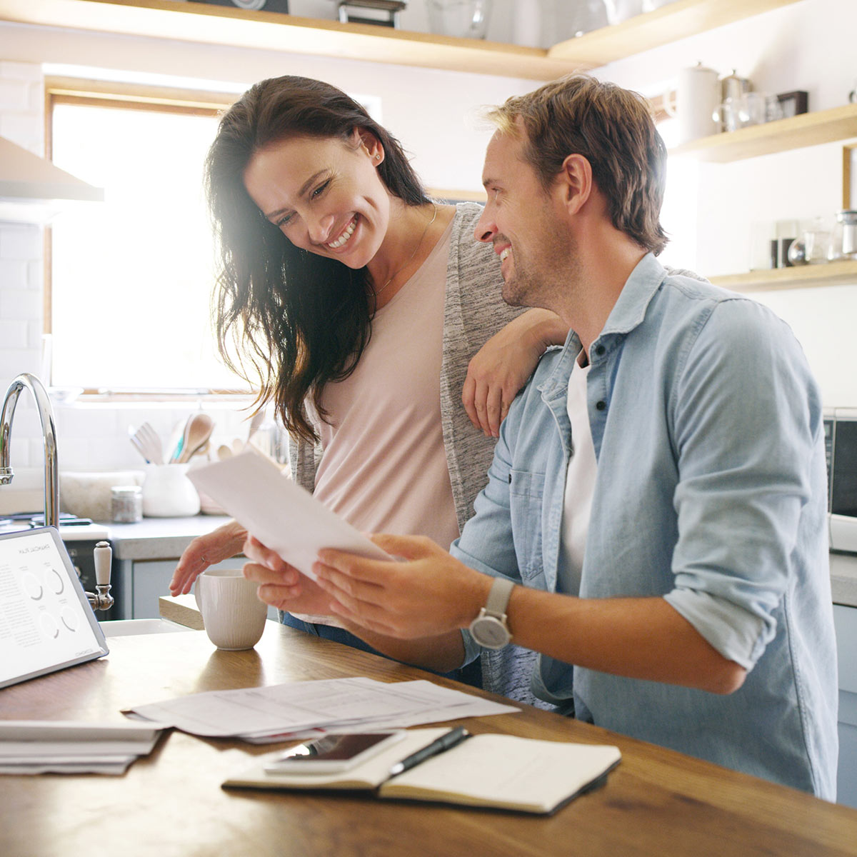 young-couple-reviewing-paperwork Young Couple Reviewing Paperwork