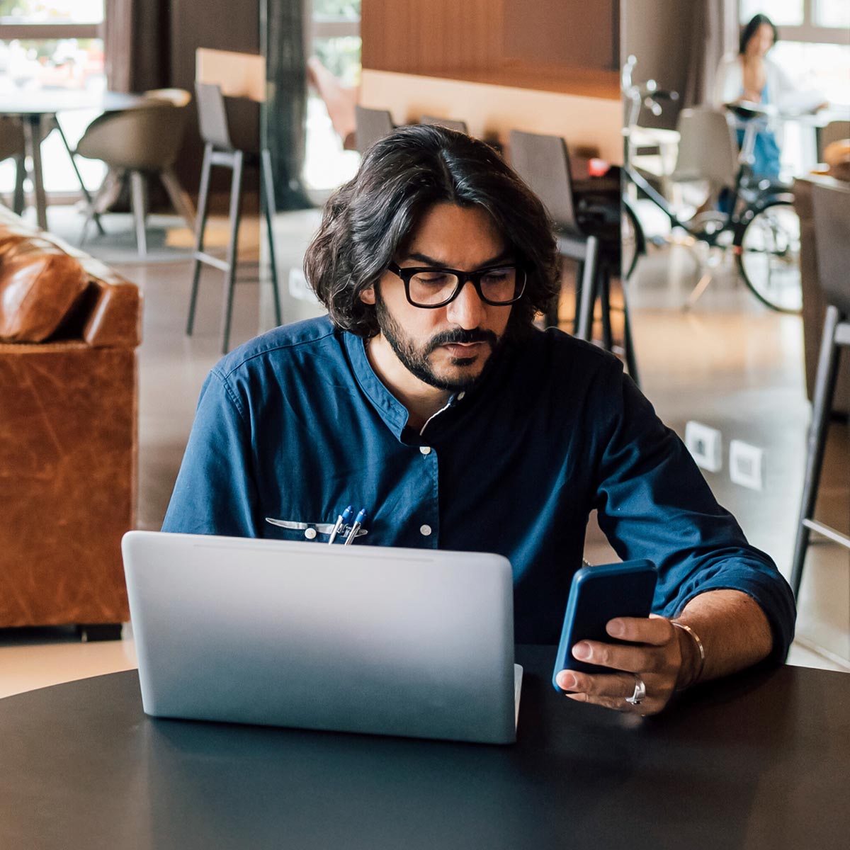man on phone working in a office environment
